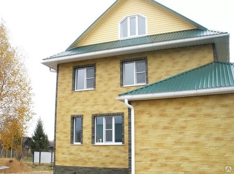 Фото домов обшитых фасадными панелями под кирпич желтый